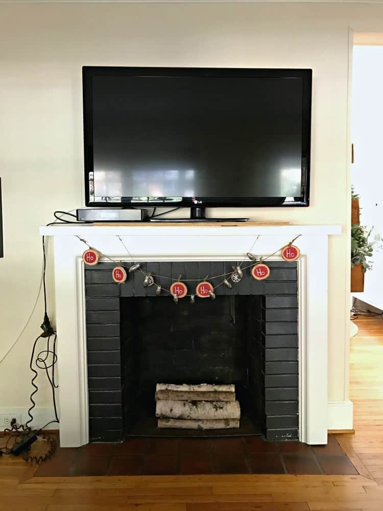 front view of fireplace with tv on mantel