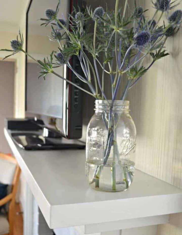 DIY Fireplace Mantel Makeover img jar of flowers on fireplace mantel