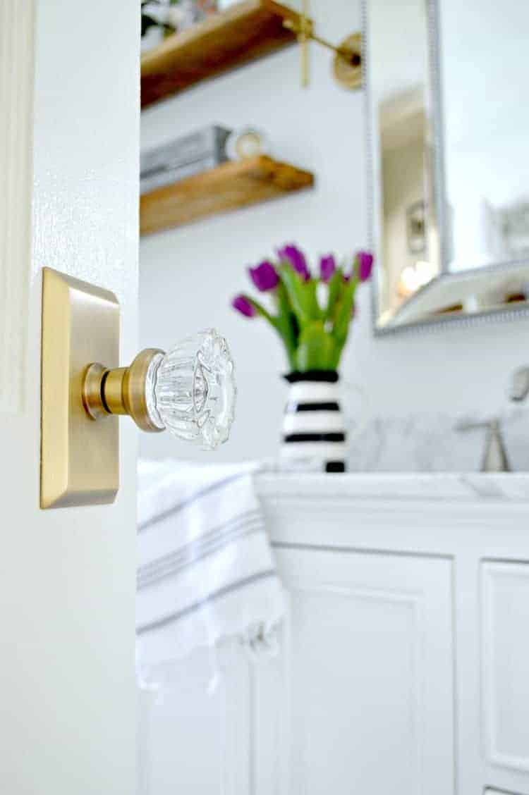 glass door knob with brass plate on bathroom door