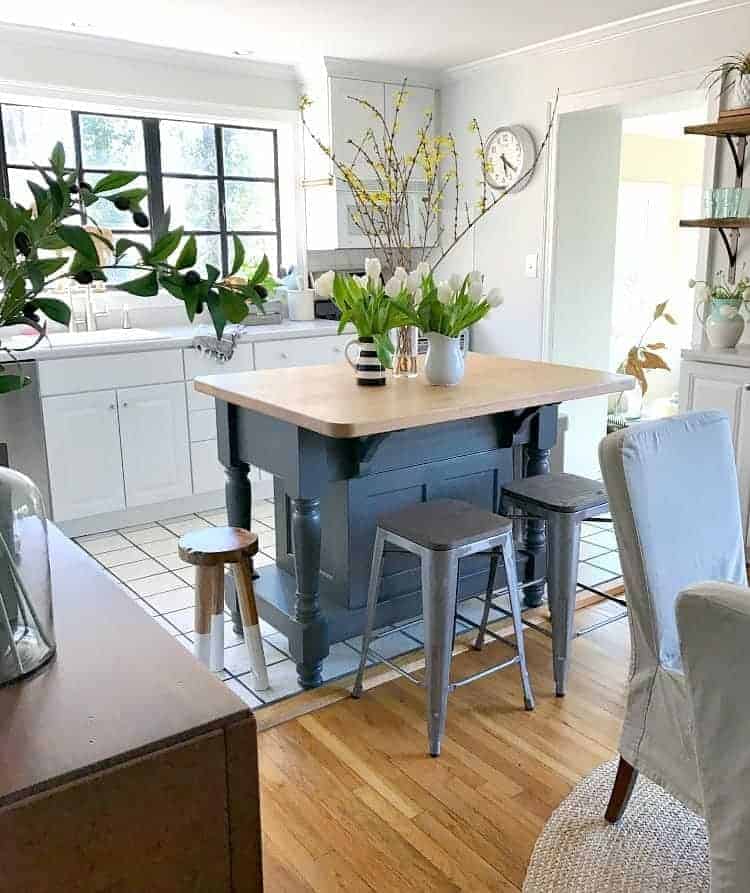 An update on our cottage kitchen in our 1946 stone house that we moved into 18 months ago. We did everything from new appliances to painting the window trim black.