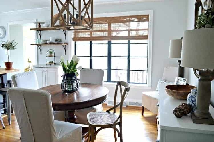 Adding farmhouse charm to a small dining area by painting old casement windows black. Chatfield Court