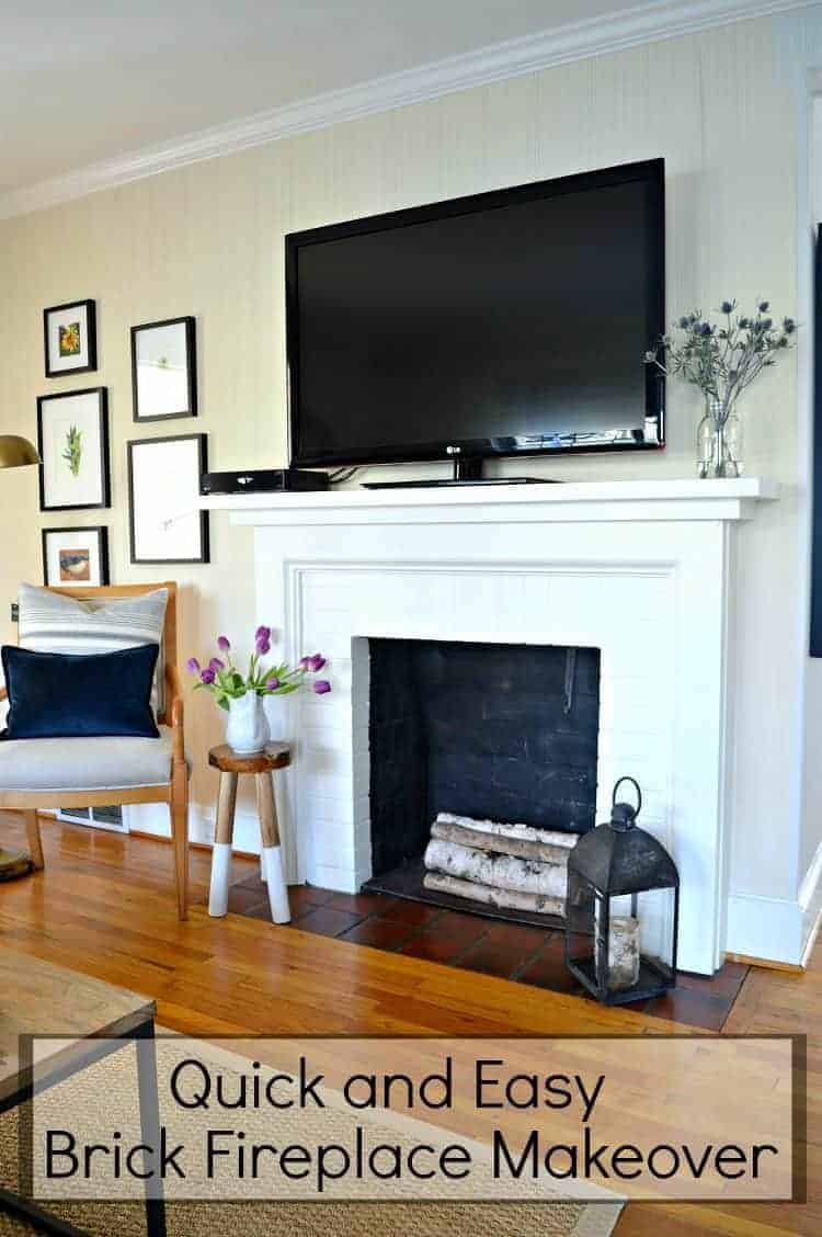 view of white painted fireplace with tv on mantel