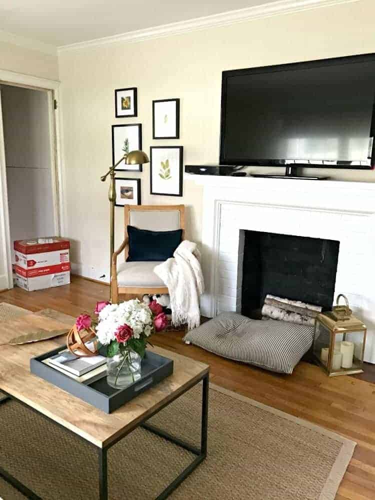 living room view of basement door opening