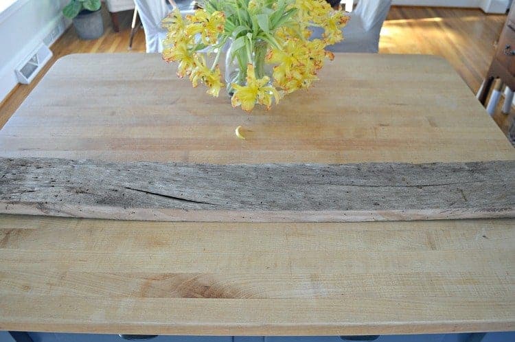 old piece of barn wood on kitchen island