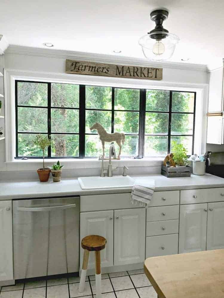 DIY wood farmer's market sign hanging in kitchen