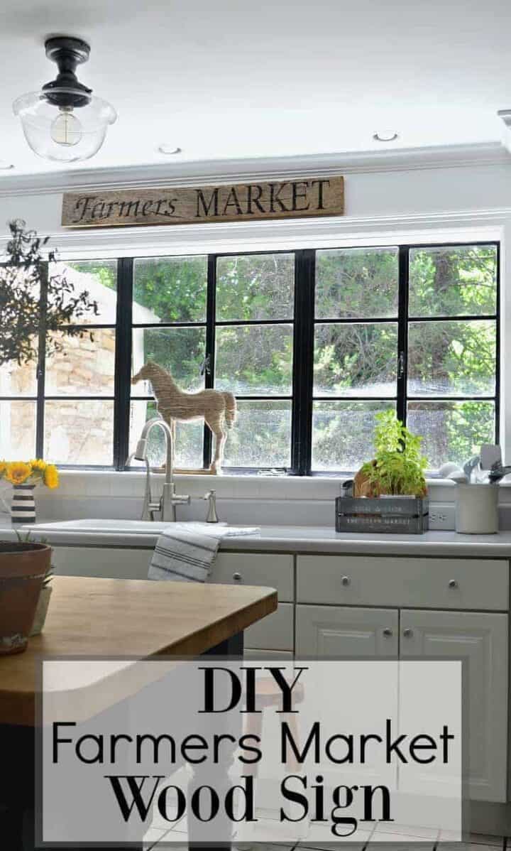 farmers market sign hanging over kitche sink and large graphic