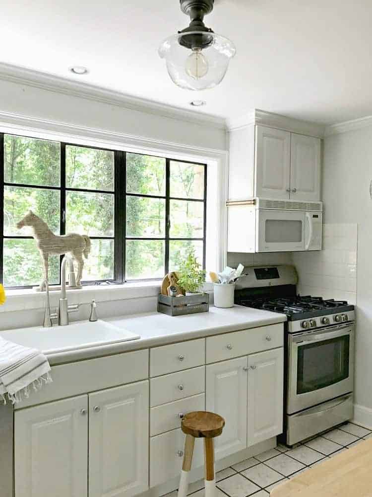 Removing an old fluorescent light and installing a new kitchen ceiling light to add a bit of farmhouse charm to a small space. | Chatfield Court