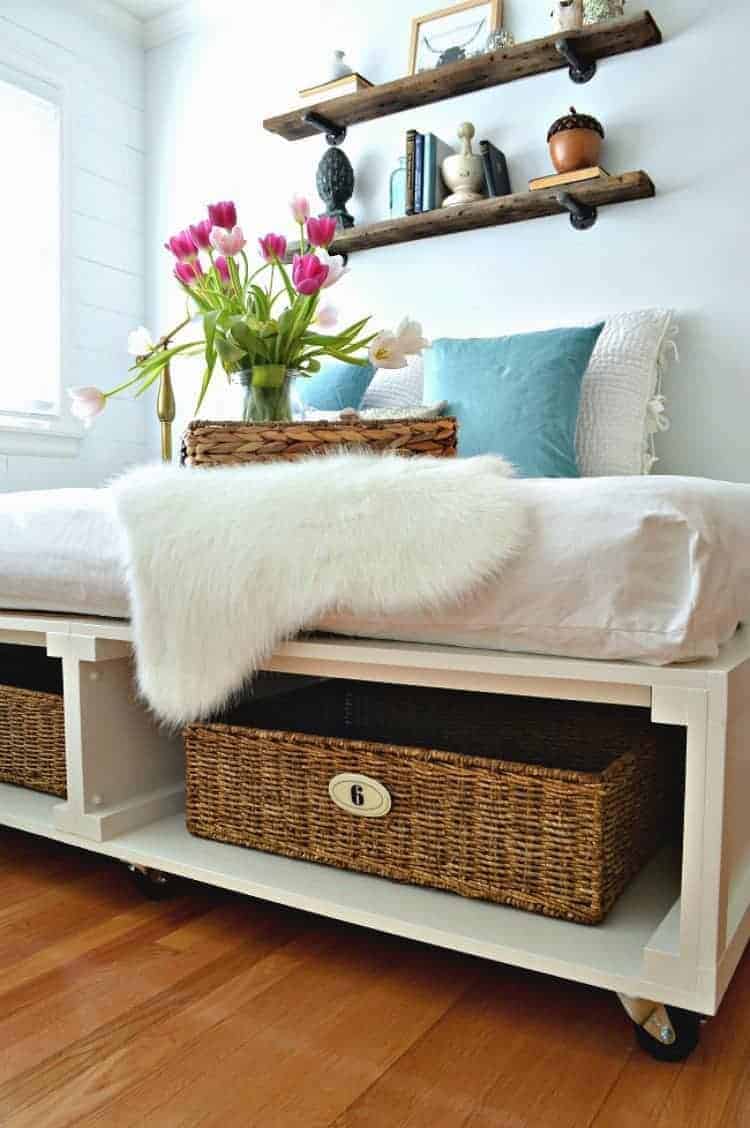 DIY platform bed with tons of storage and wheels so you can move it. So clever! 