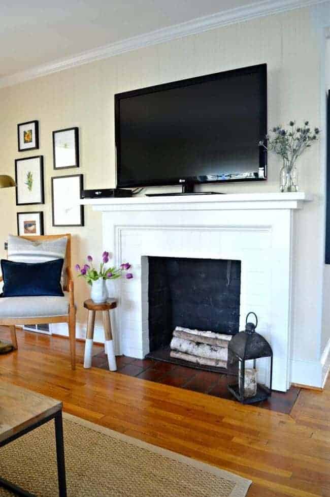 Change the look of a fireplace with a little bit of elbow grease and fresh paint. A quick and easy makeover.