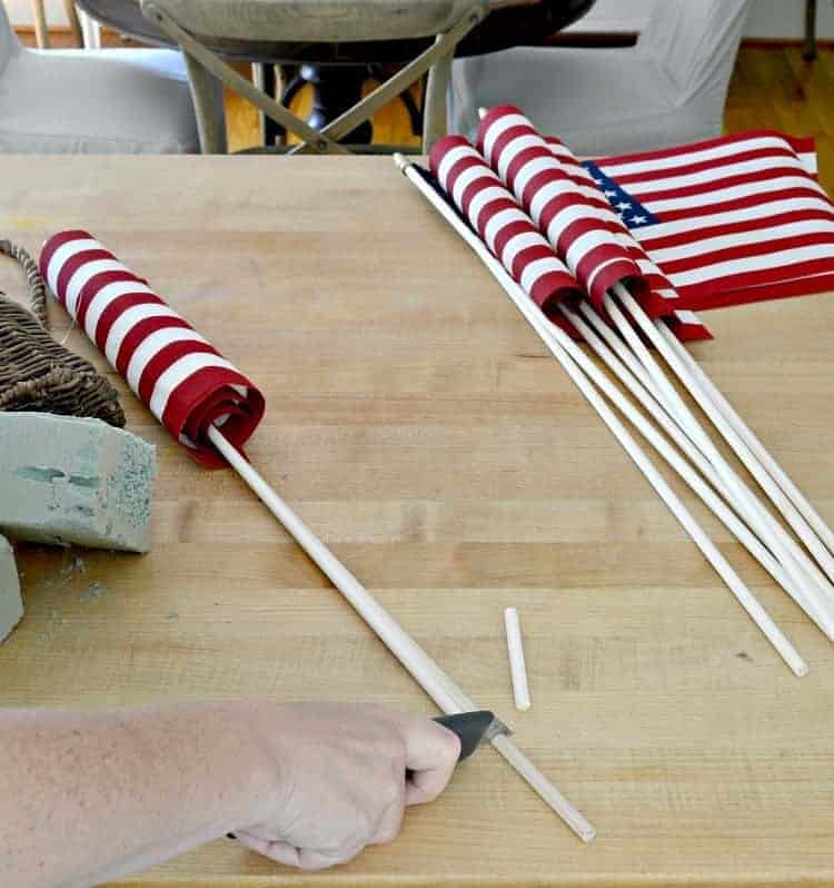 small American flags laying on wood island