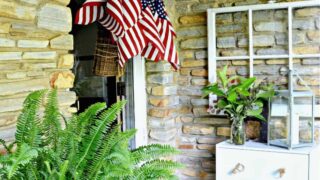 American flags in hanging basket on front door