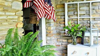 American flags in hanging basket on front door
