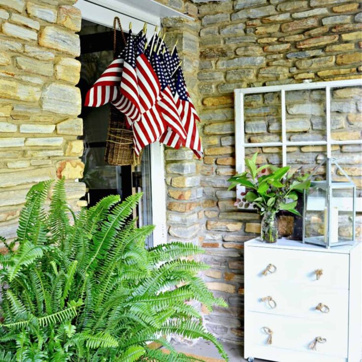 American flags in hanging basket on front door
