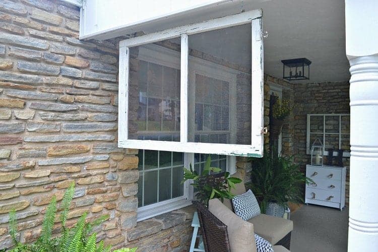 vintage window screen hanging on front porch