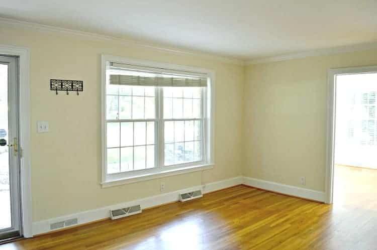 Empty living room before furniture was added and the DIY custom curtain rods and curtains were installed.