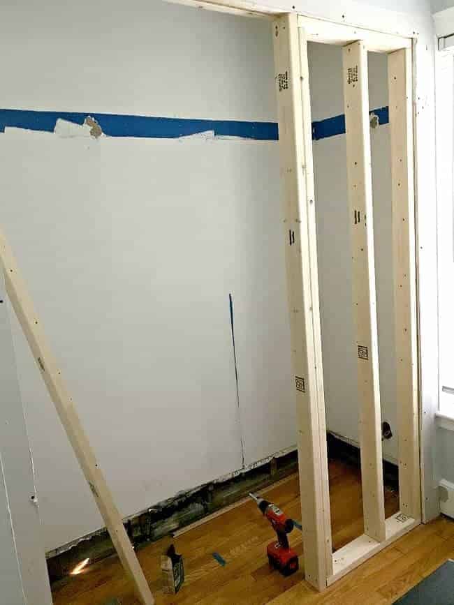 Framing the walls during the small powder room transformation.