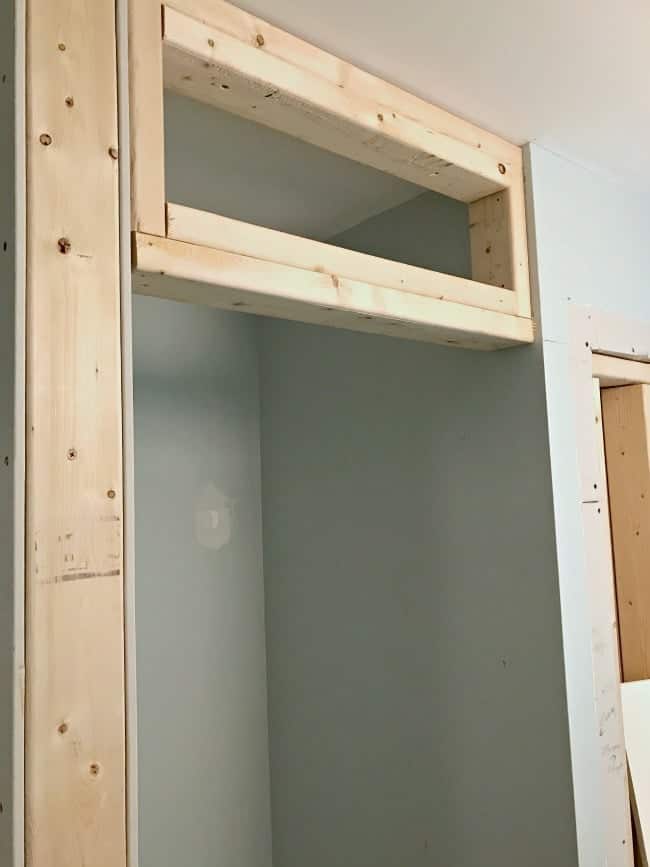 Framing out the small bedroom closet next to the powder room.