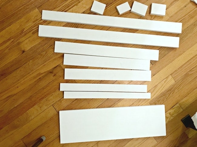 Laying out the pieces to build the DIY powder room vanity.