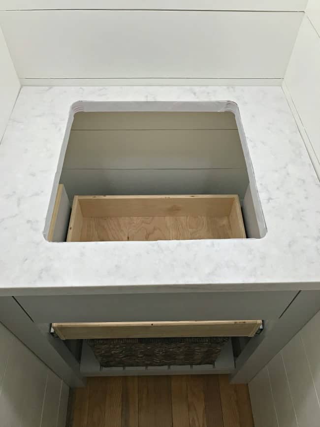 DIY powder room vanity and countertop installed.