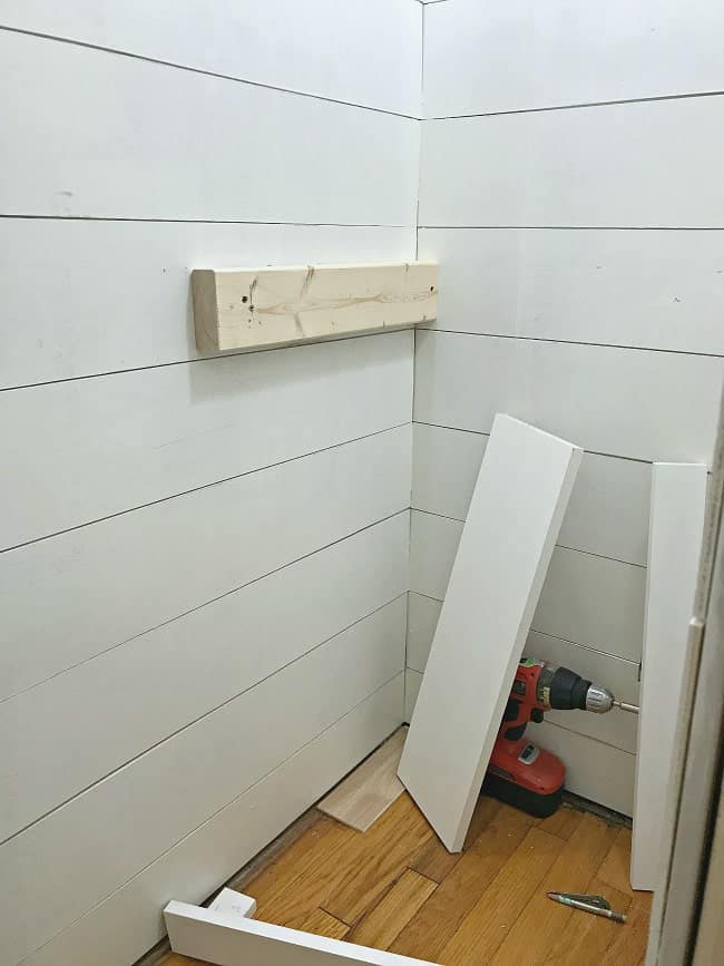 Building the walls in our closet turned powder room project.