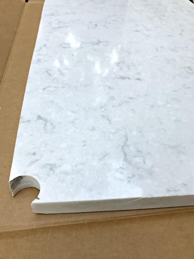 Cutting a piece of Silestone to use as a countertop on a DIY powder room vanity.