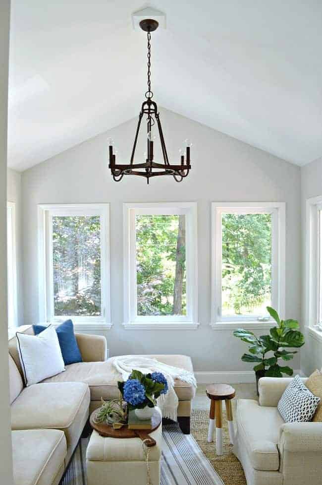 Tackling phase 1 of a small sunroom makeover using paint and new lighting. Change the look of your room with simple decor ideas.