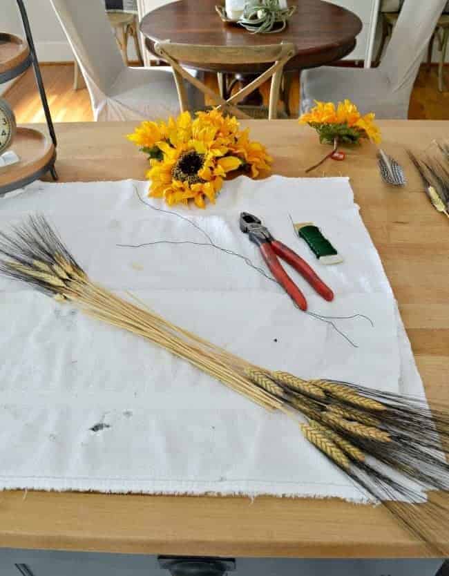 Using wheat to create a simple DIY fall front door wreath. 