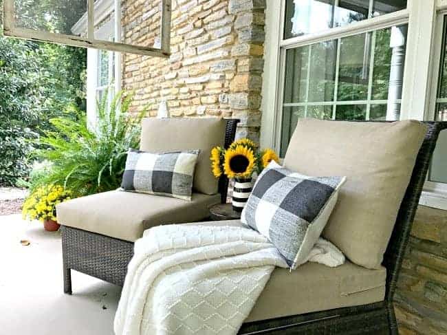 two chairs with pillows on covered porch