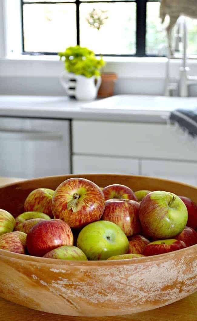 apples in wood bowl