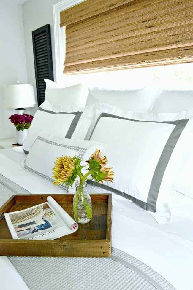 5 tips and ideas to help you create a cozy bedroom for fall using beautiful crisp white linens. 