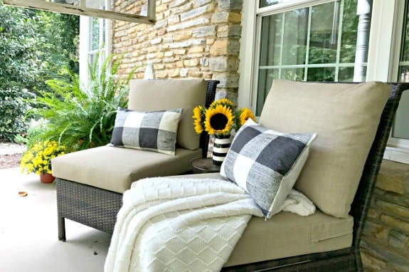 fall front porch with 2 chairs with pillows on them