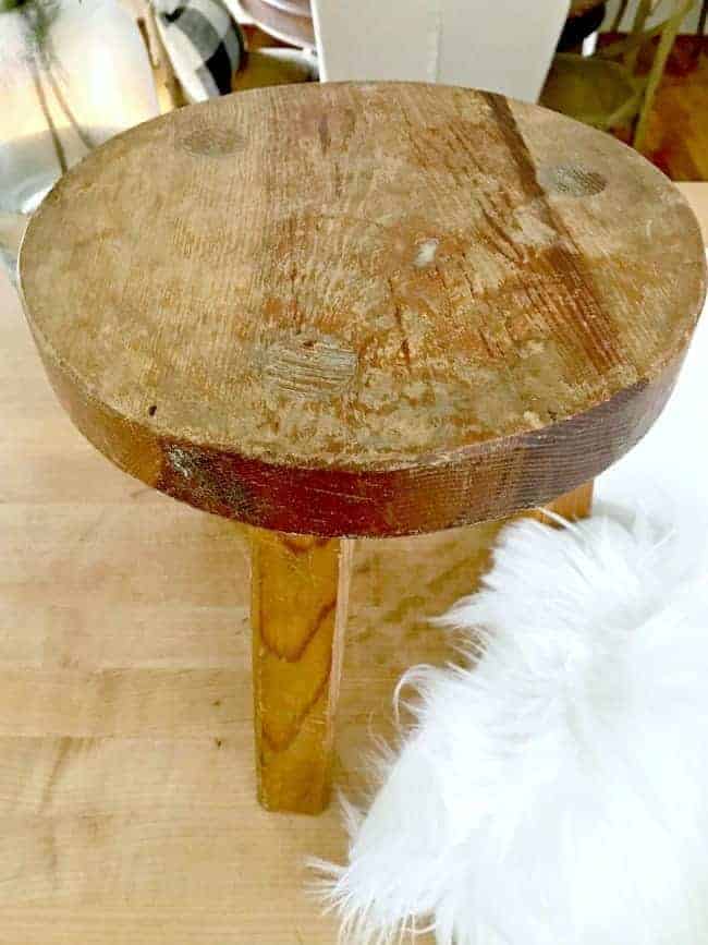 old wood stool and piece of faux fur