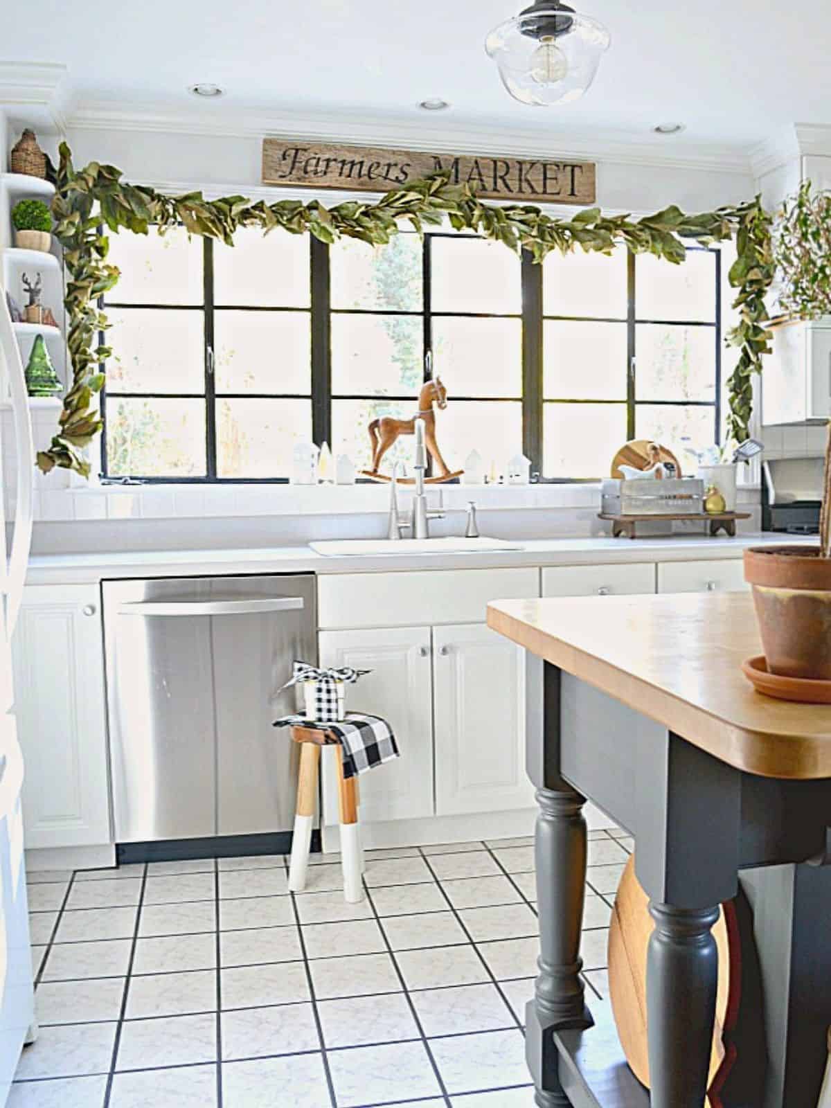 DIY Magnolia Leaf Garland magnolia leaf garland hanging on kitchen window