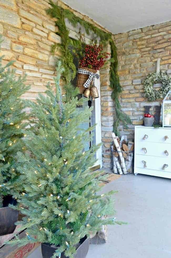 faux lighted trees on front porch