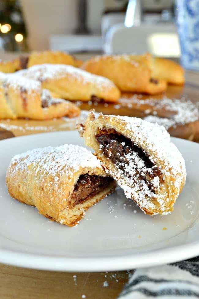 Nutella rolls with powdered sugar on plate