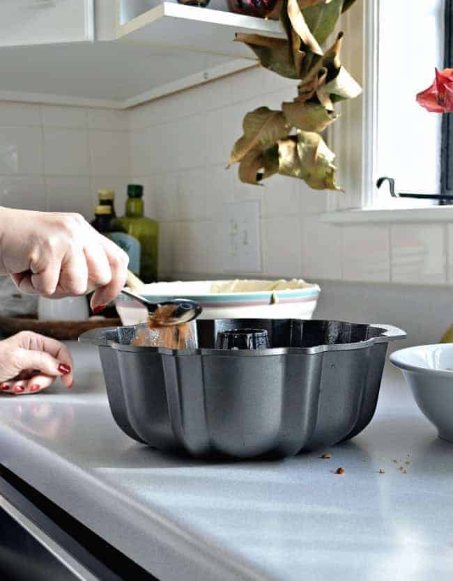 sprinkling nut and sugar mixture in cake batter