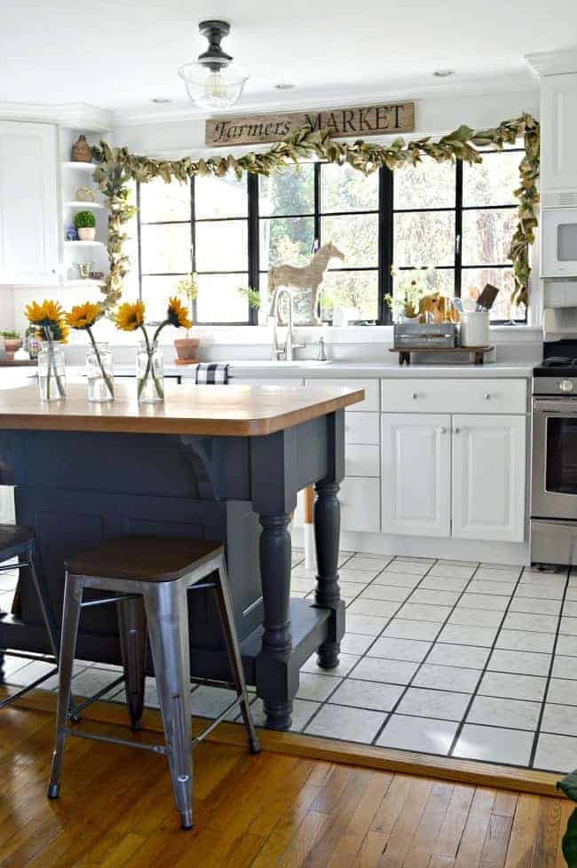 kitchen with large island painted dark gray