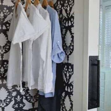 closet with white clothes hanging in it