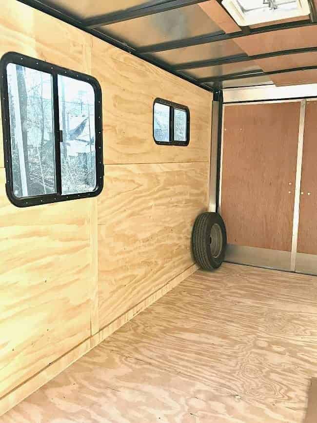 inside the tiny RV trailer where the table will be, under the window