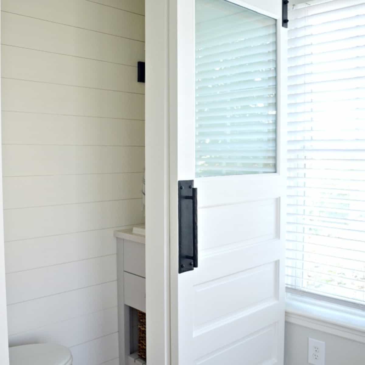 powder room barn door made from curbside door