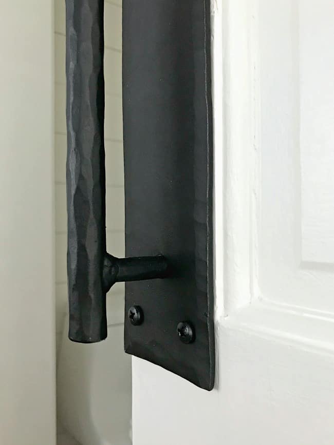 iron handle on white door