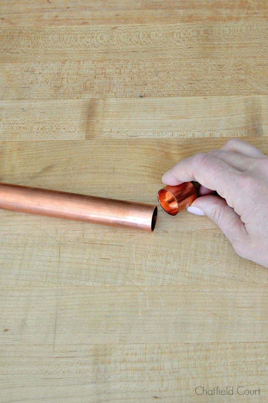 putting a copper tube cap on a copper pipe