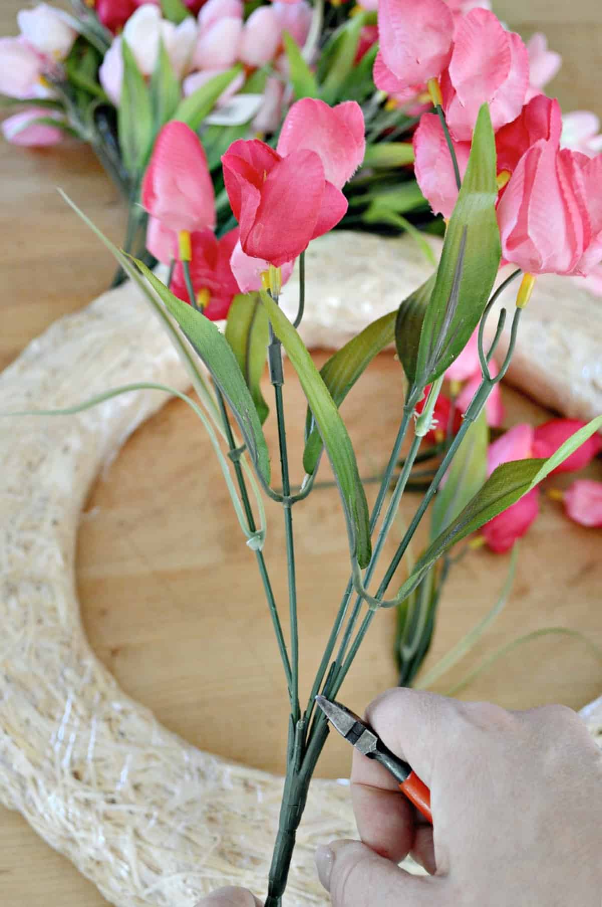 snipping faux pink tulips with nippers