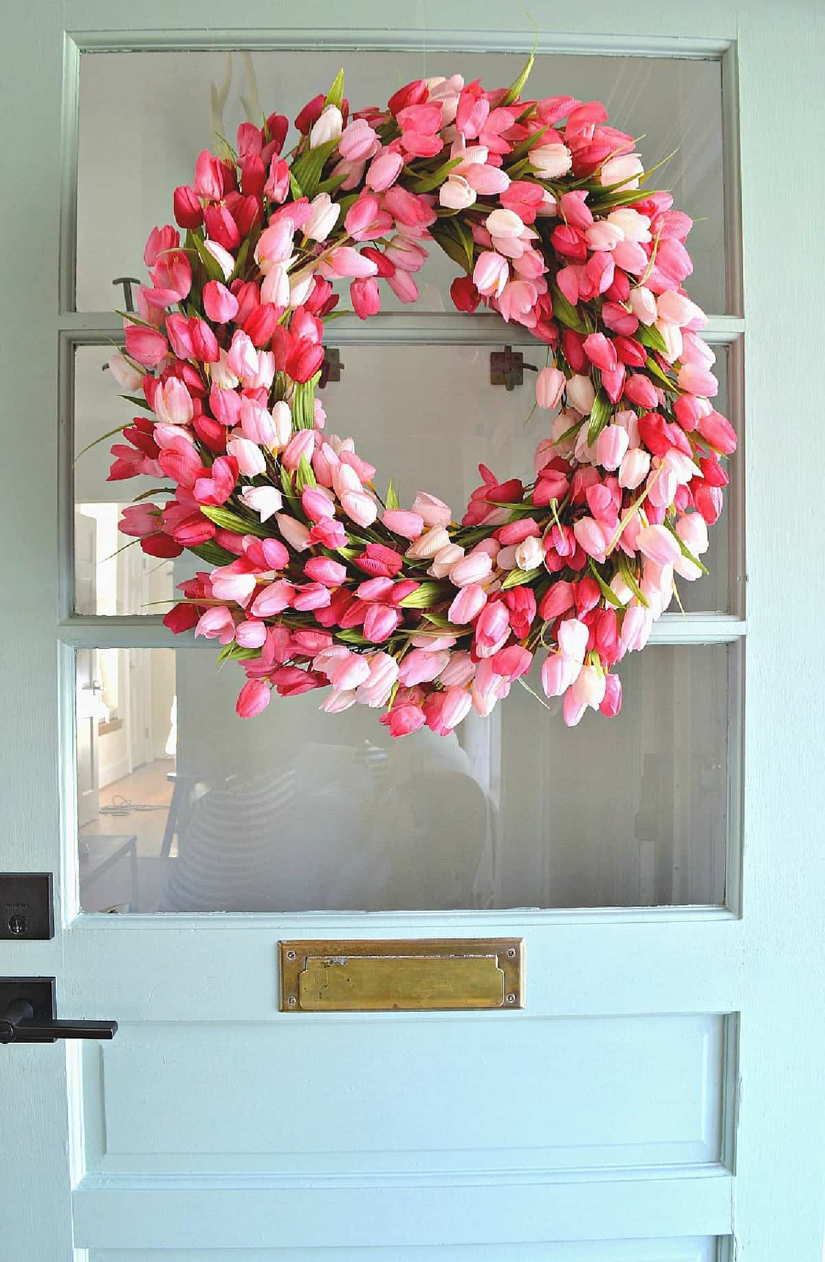 A tulip wreath on a front door