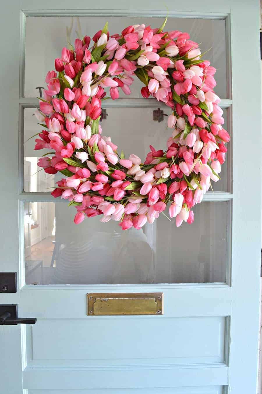 An Easy Tulip Wreath Diy Field Court Pink Tulip Wreath Hanging On A Blue Farmhouse Front Door