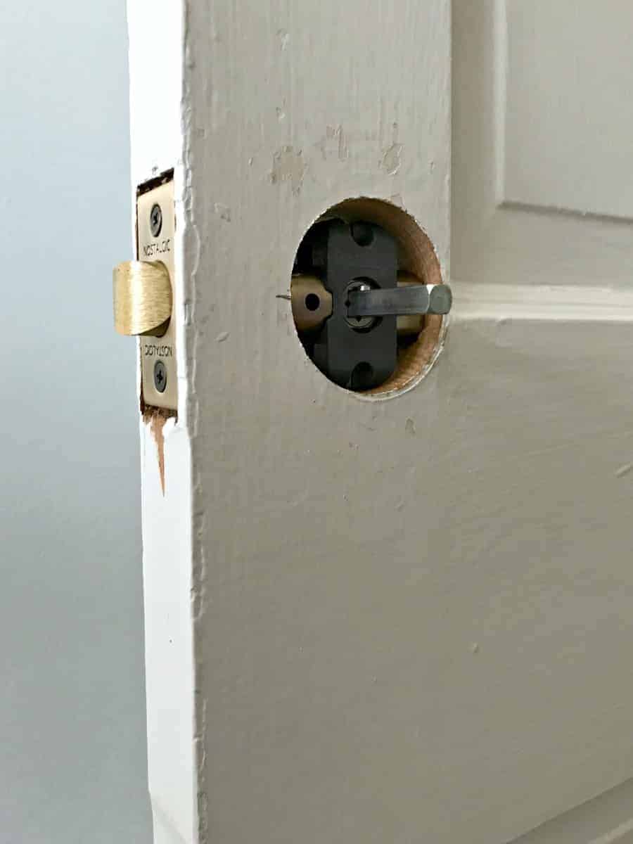 new hole in wood door for new door knob
