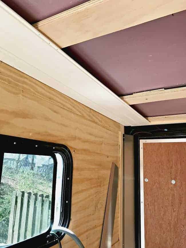 2 tongue and groove wood planks installed on RV ceiling