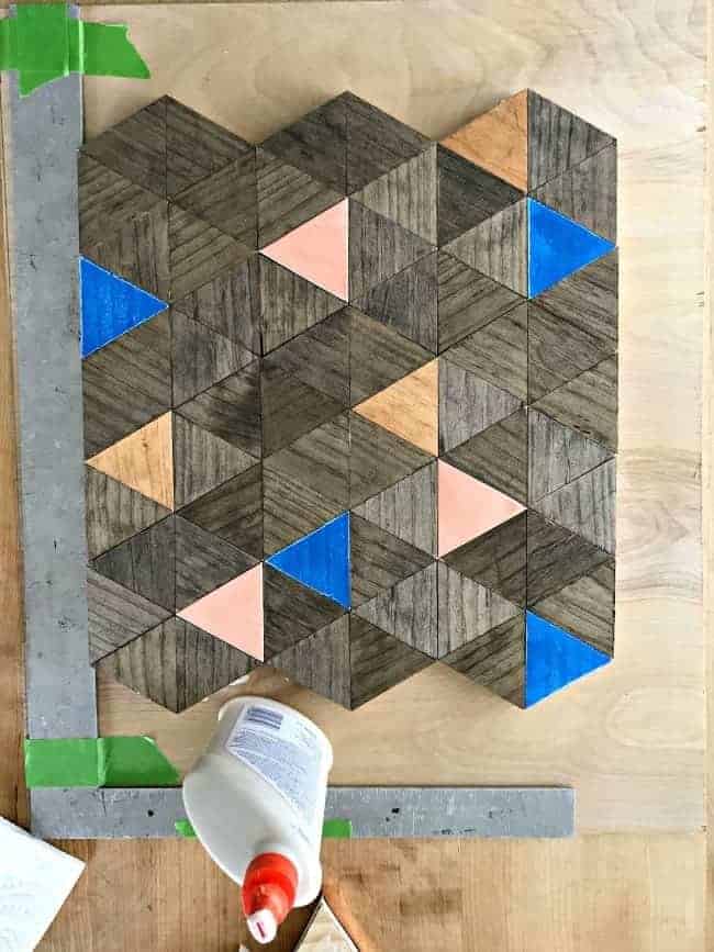 wood triangles getting glued onto underlayment