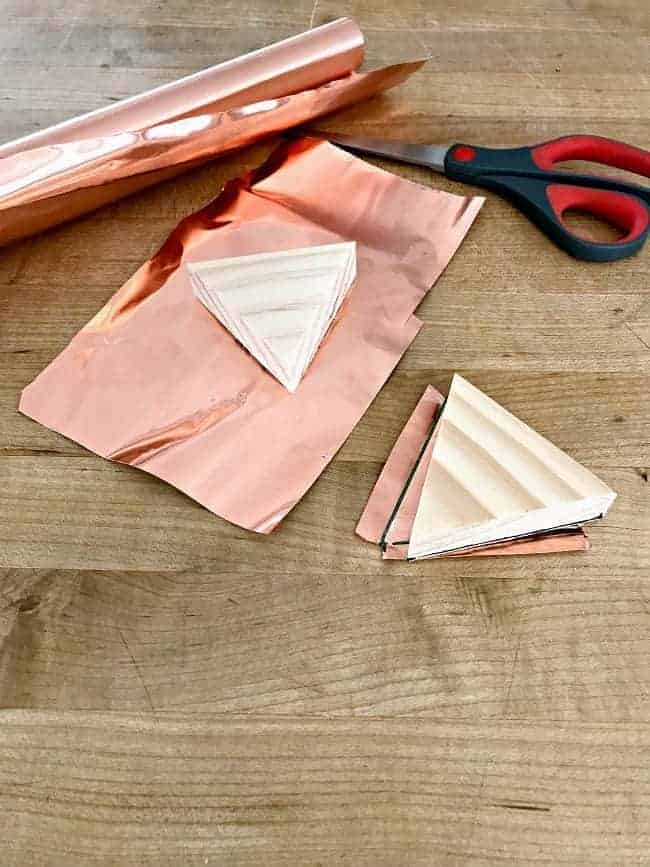 copper sheet and wood triangles