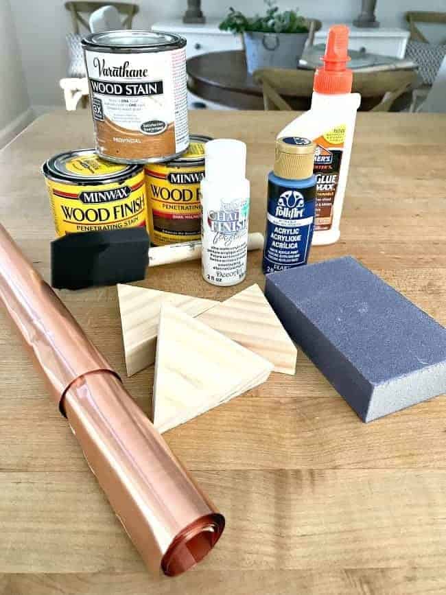 paint, stain and other supplies used to make wood wall art